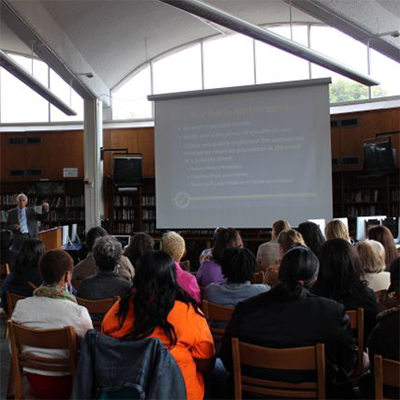 Human Intelligence Group instructor providing training to an attentive group.